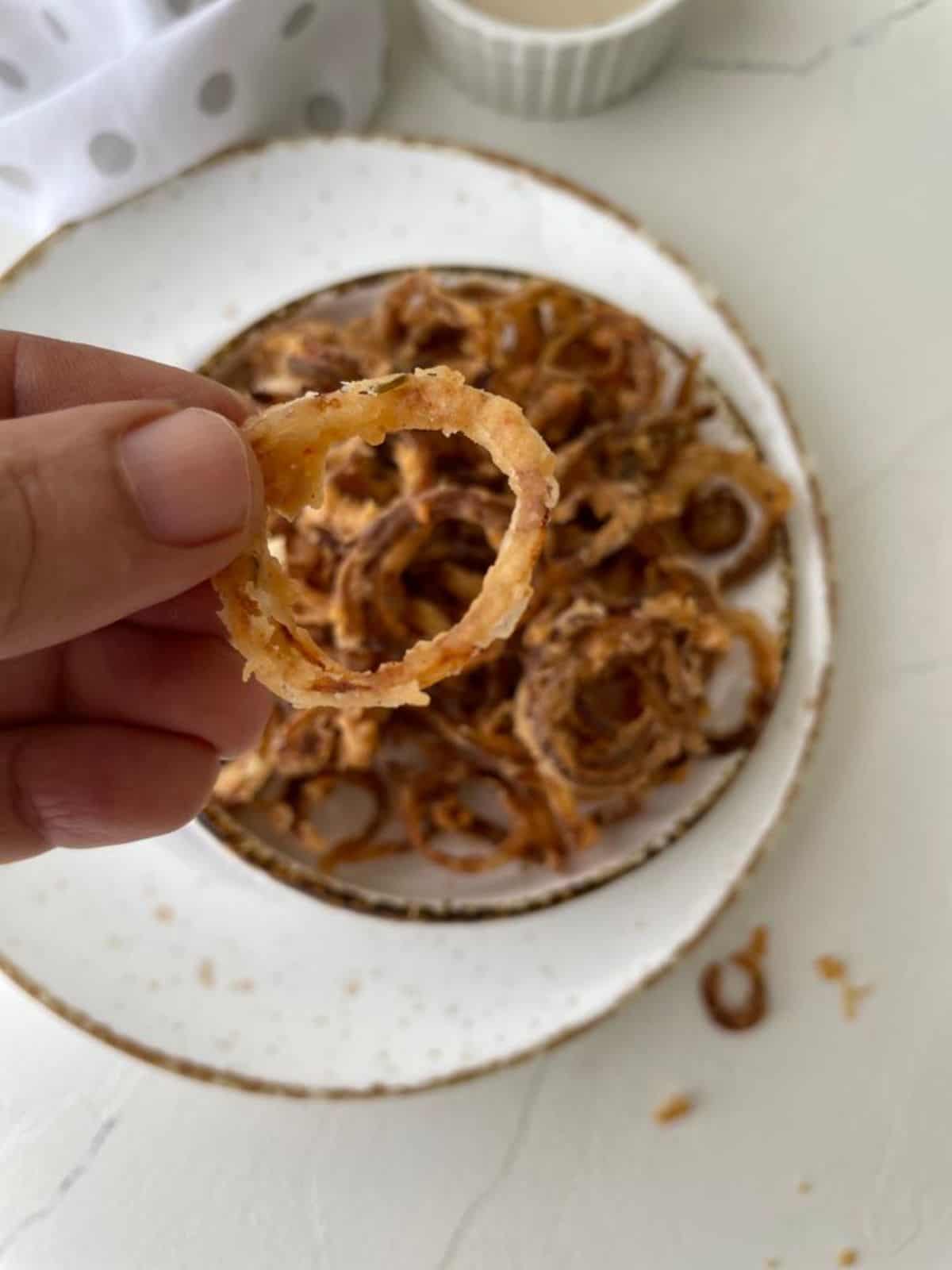 hand holding tobacco onions
