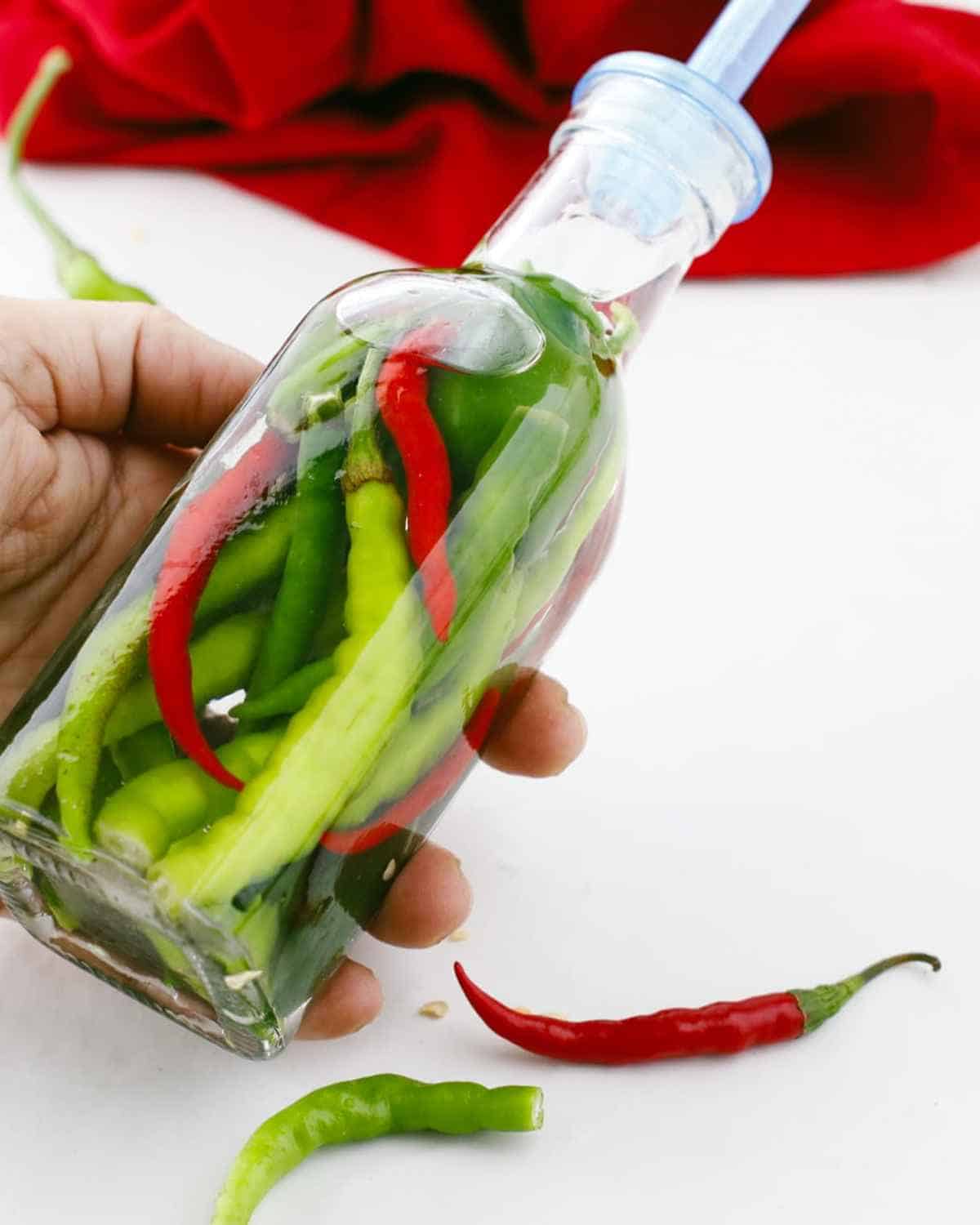 A jar of Hot Pepper Vinegar on hand