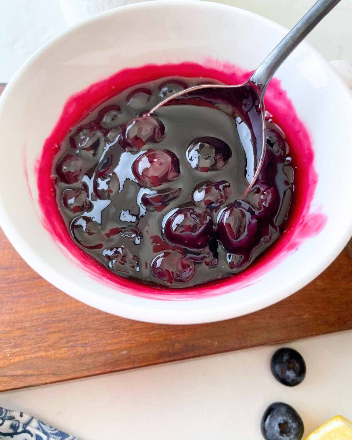 Yummy Classic Blueberry Sauce with spoon in a bowl