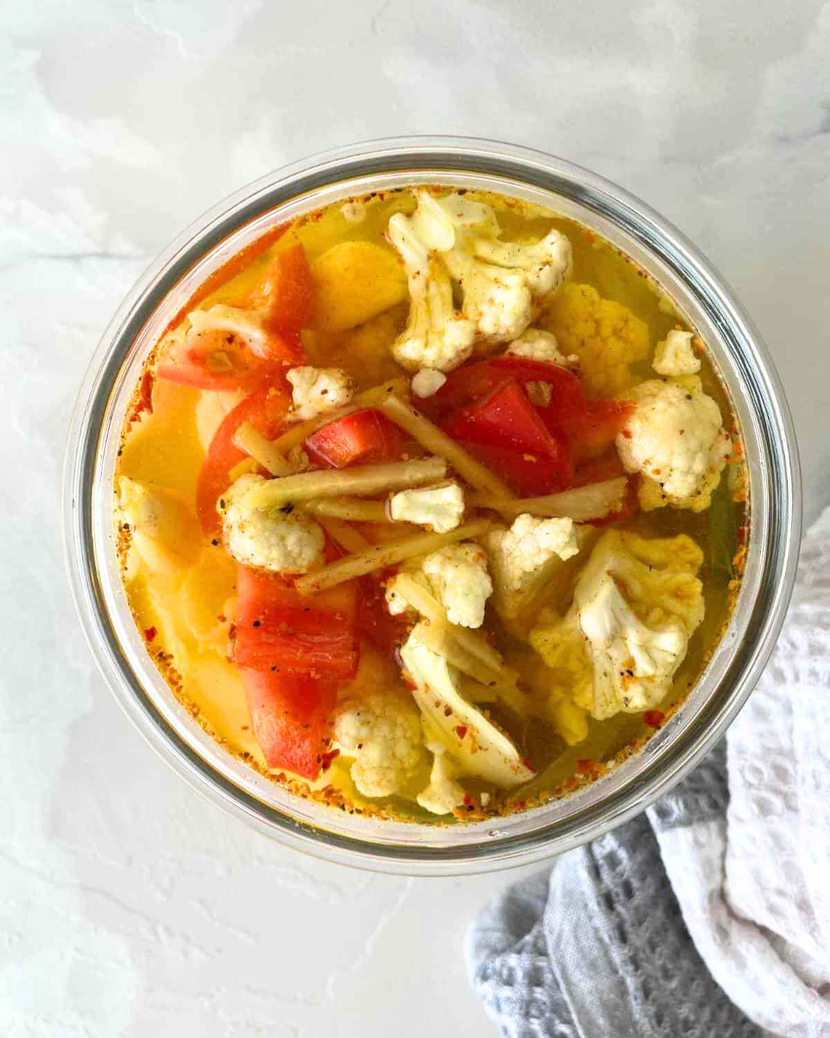 Top view image of Curry Pickled Cauliflower in a jar