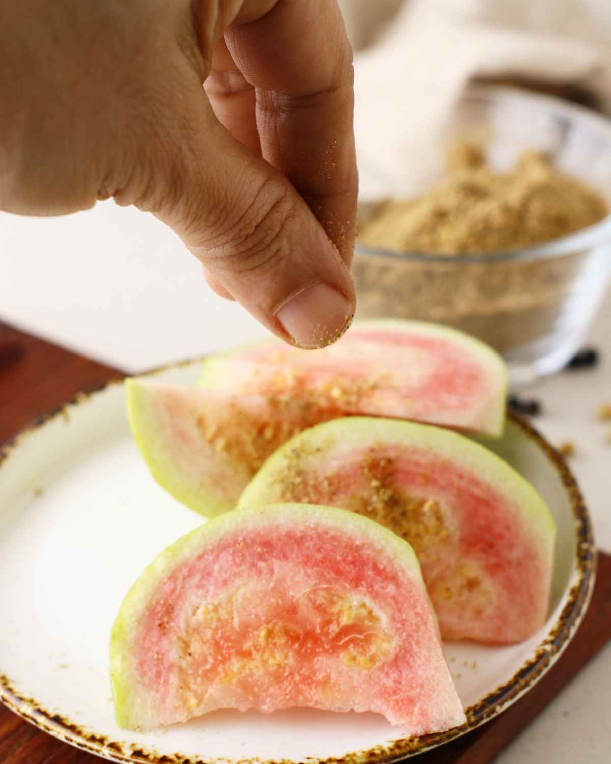 Delicious Homemade Chaat Masala sprinkling over Guava Pieces 