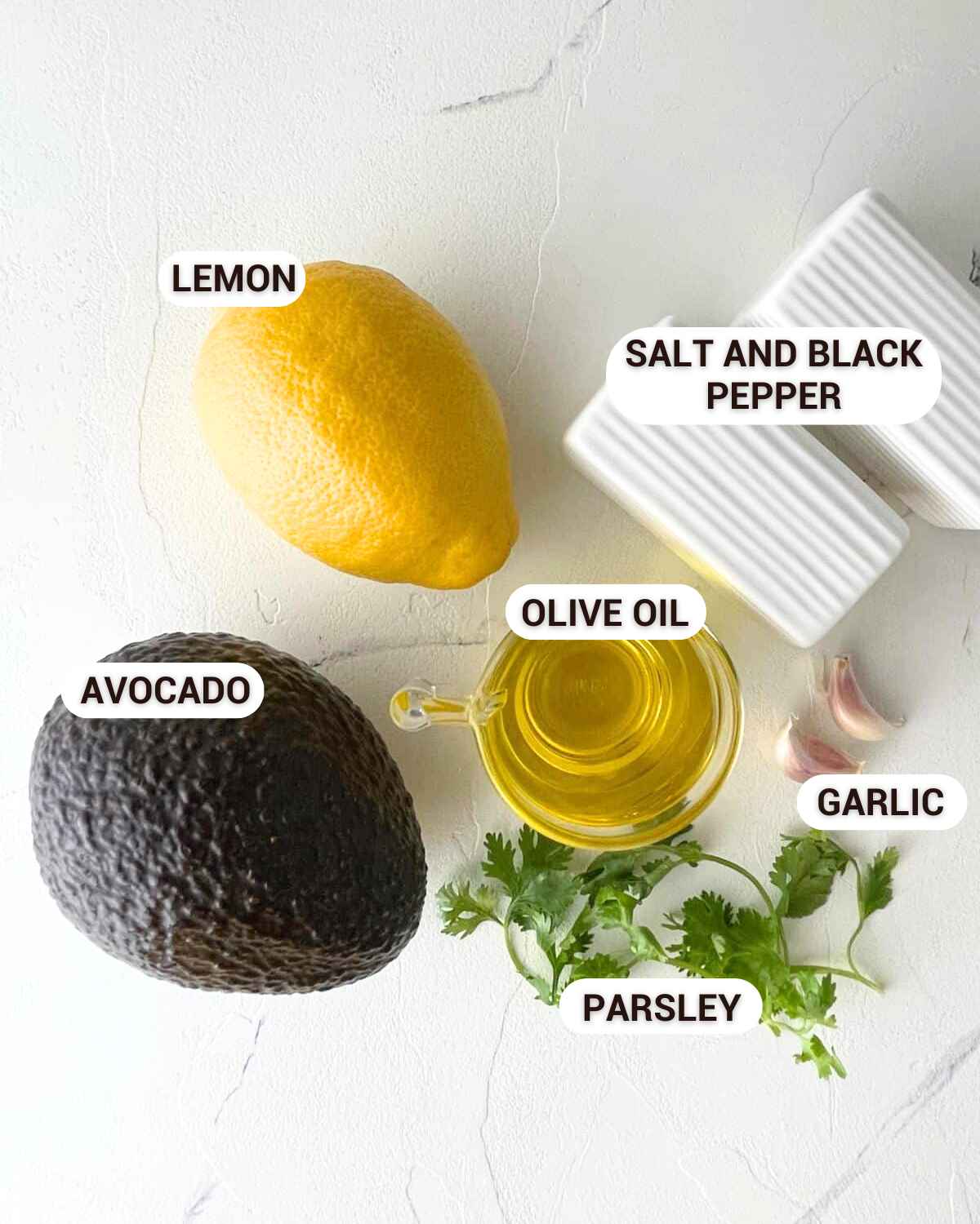 Ingredients for Garlic Avocado Spread in a bowl