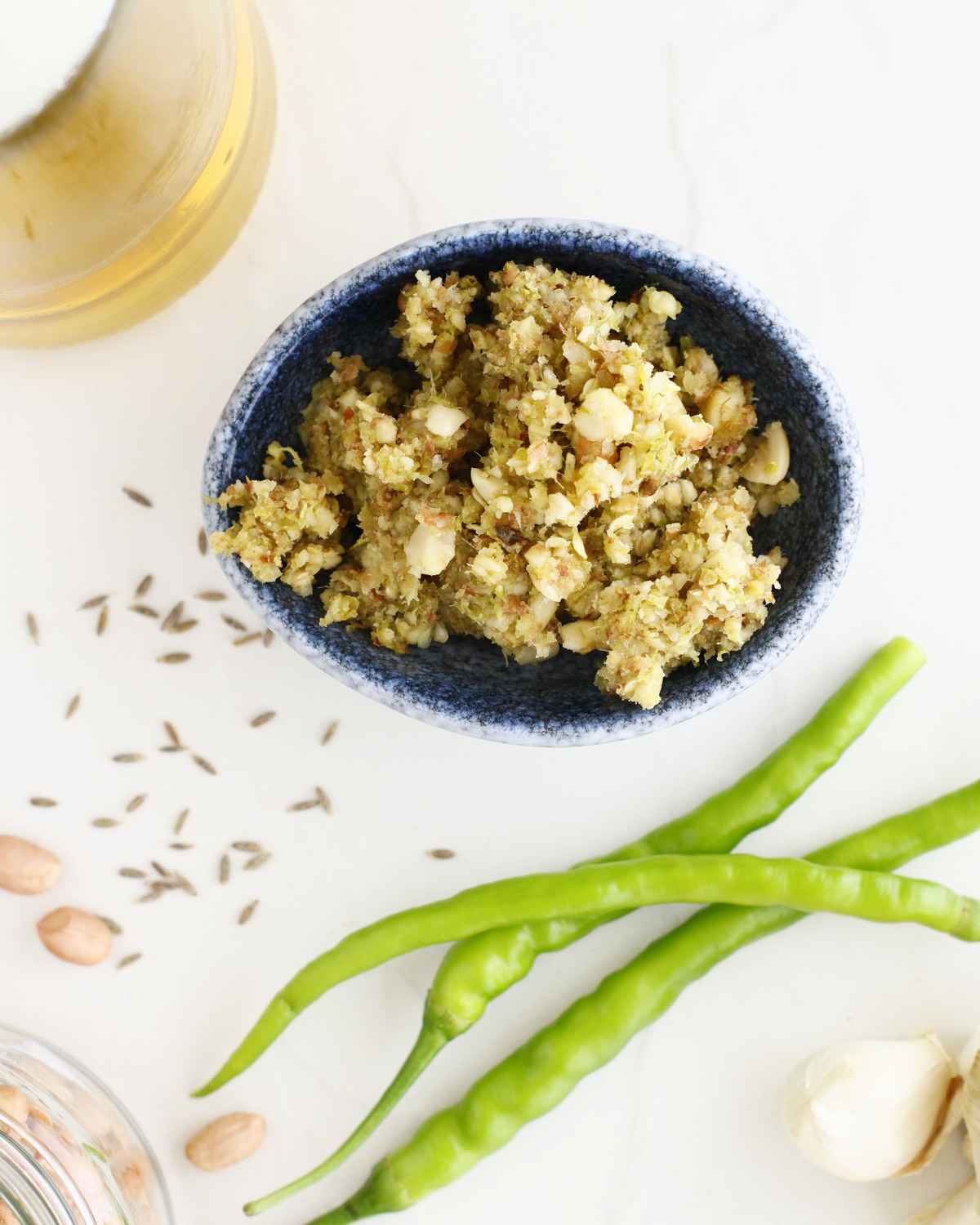 Delicious Green Chili Thecha with some fresh green chilies in the background