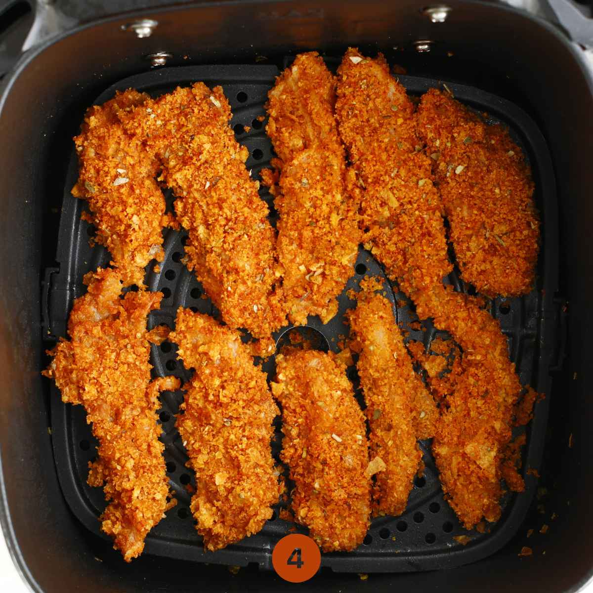 Transfer the chicken tenders in an air fryer and cook for 10-12 mins