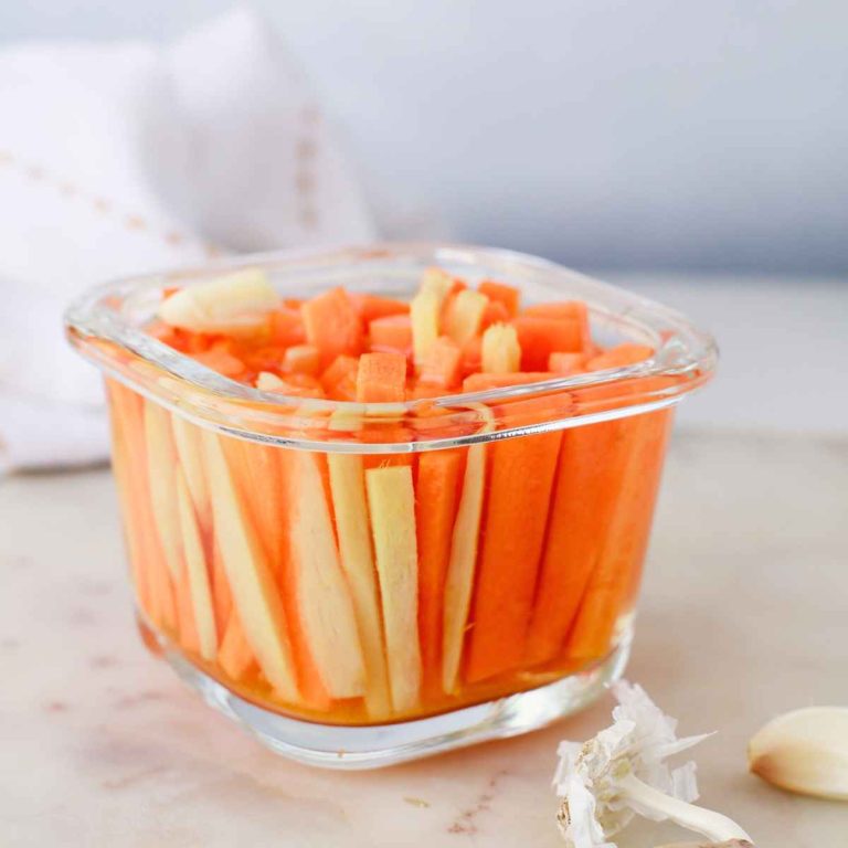 carrot and ginger sticks pickled in a jar